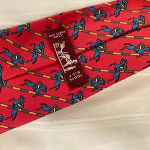 almost new charming Hermes red tie with riders and horses
